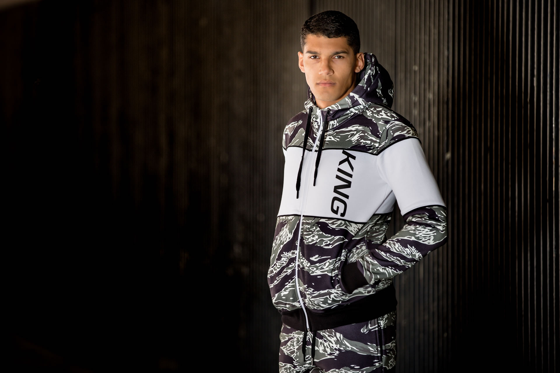 Model wearing tiger camo SS19 King Apparel Manor tracksuit