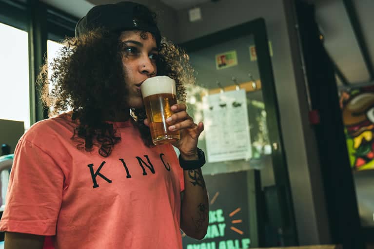 FFSYTHO wears King Apparel Stepney t-shirt in coral