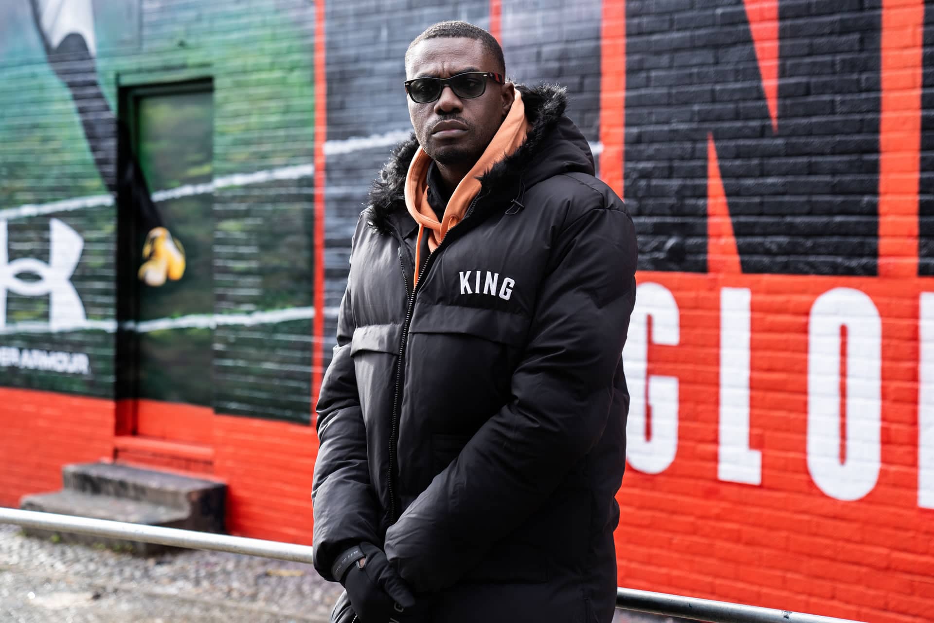 King of Trainers wears King Apparel Shadwell longline jacket in black