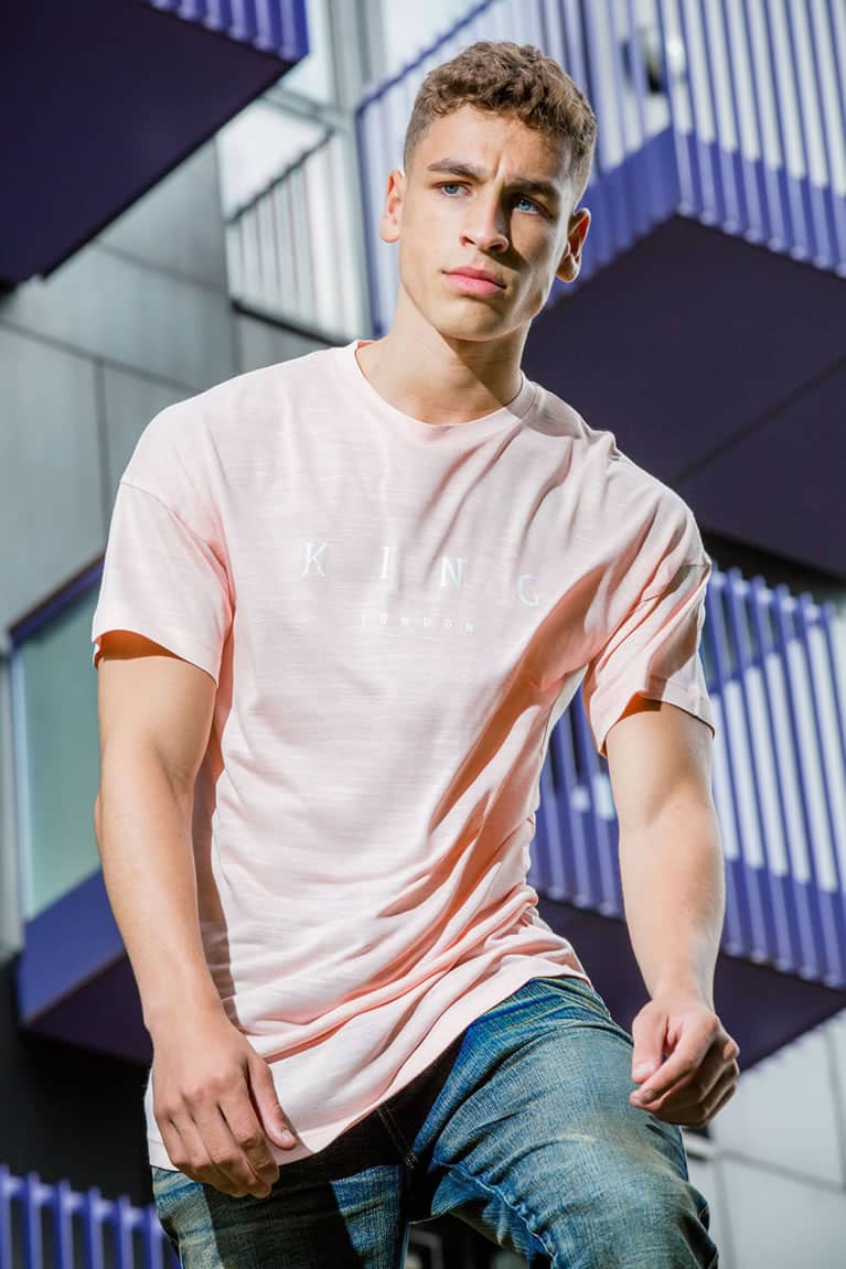 Model wears t-shirt and jeans from King Apparel Spring / Summer 2018 collection