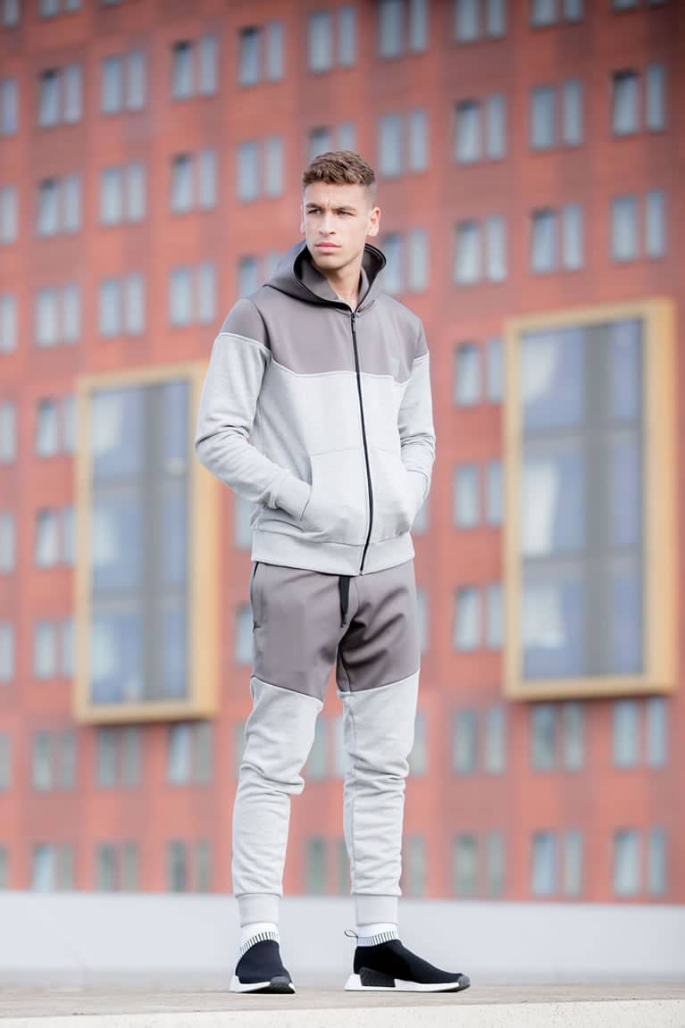Model wears tracksuit from King Apparel Spring / Summer 2018 collection