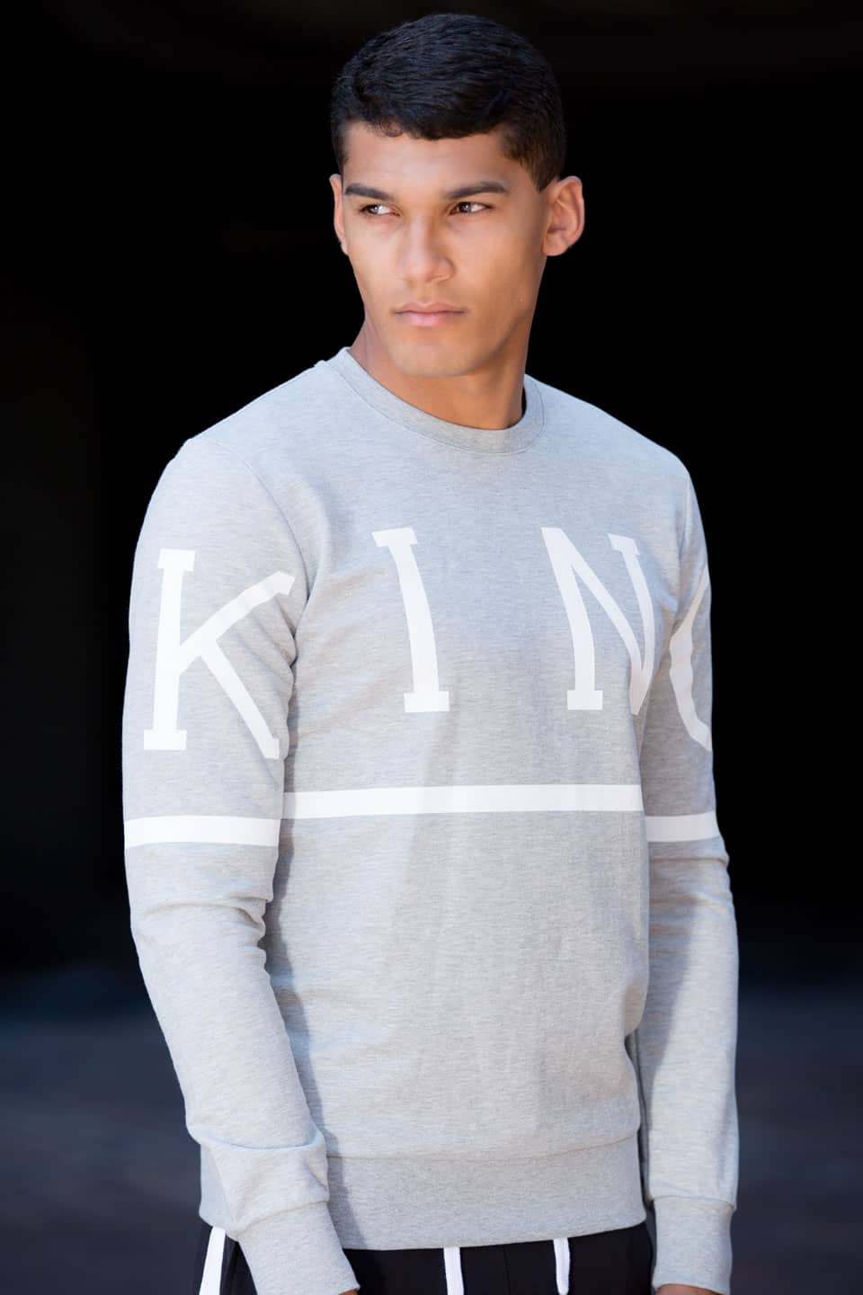 Model wears King Apparel Leyton sweatshirt in stone grey