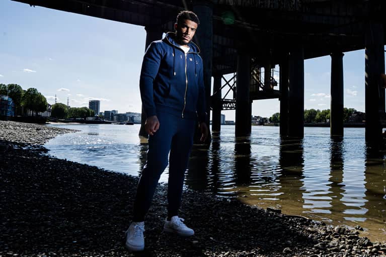 Myers wears King Apparel Tennyson Gold tracksuit in ink blue