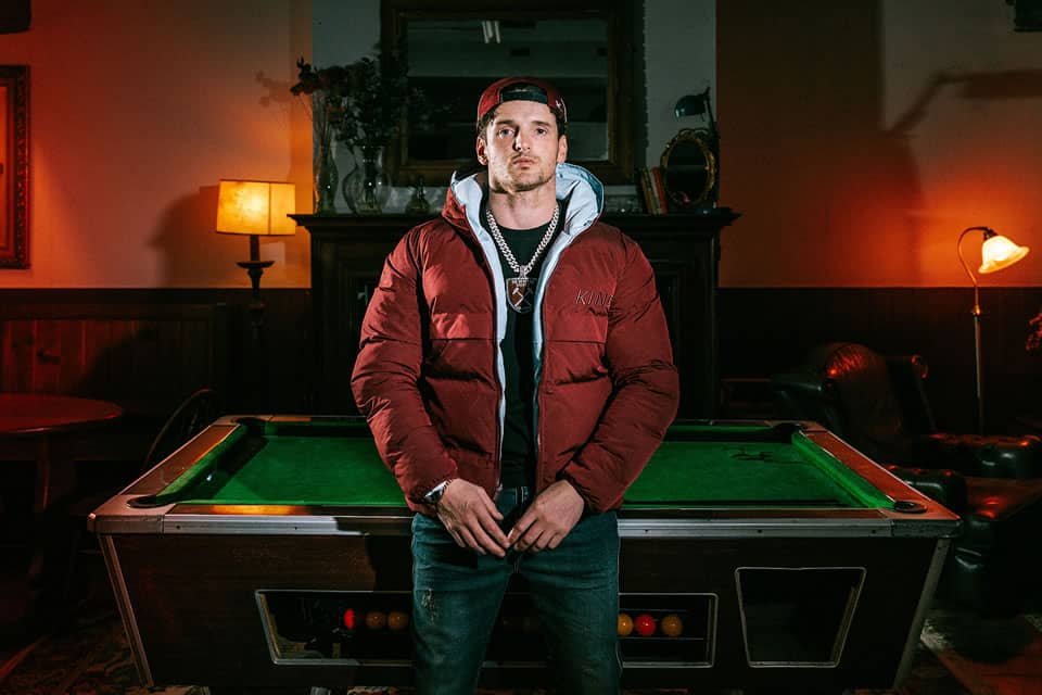 Morrisson wears King Apparel Tennyson reversible jacket in claret and blue