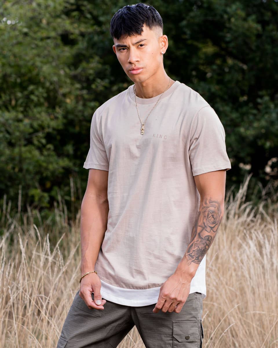 Model wears King Apparel Stamp Vent t-shirt in camel