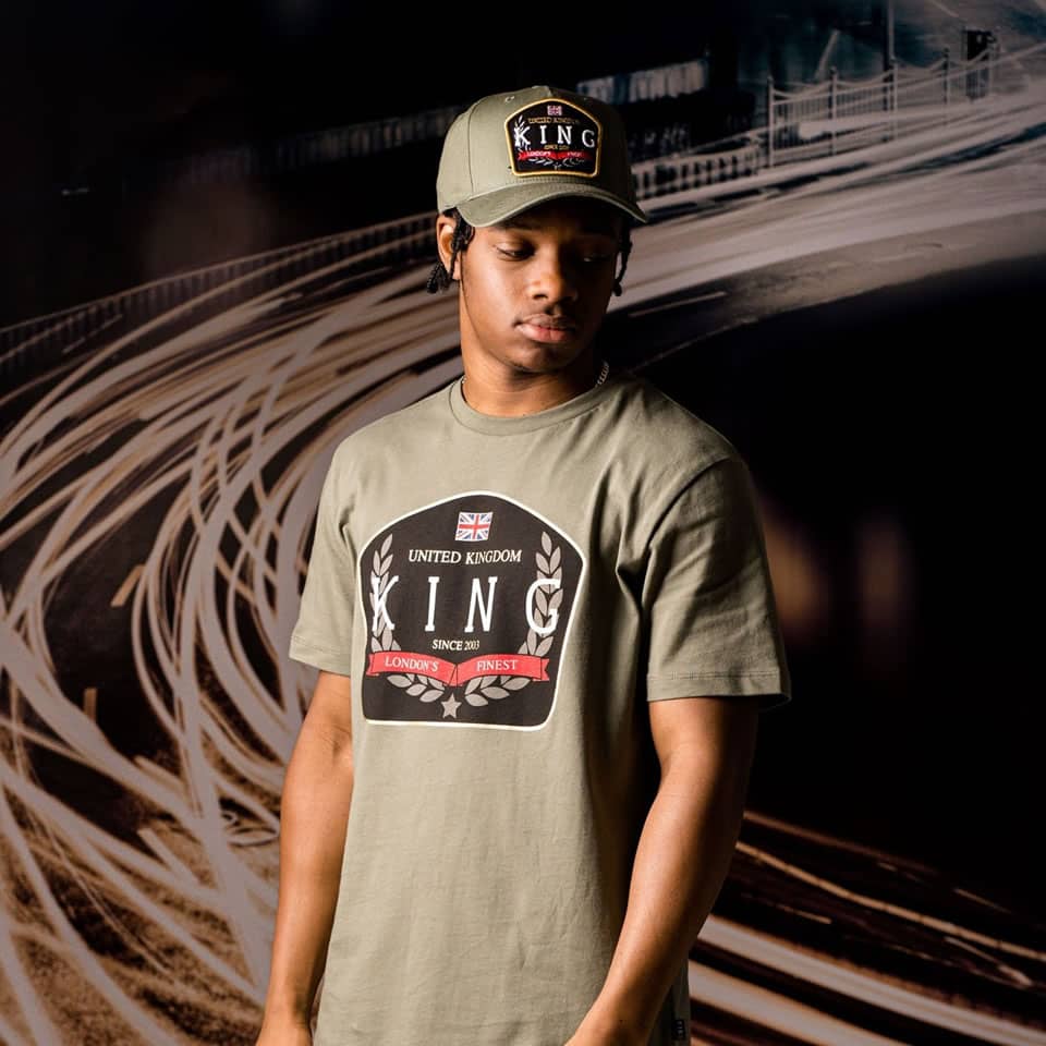 Poundz wears King Apparel Imperial curved peak cap and t-shirt in fern green